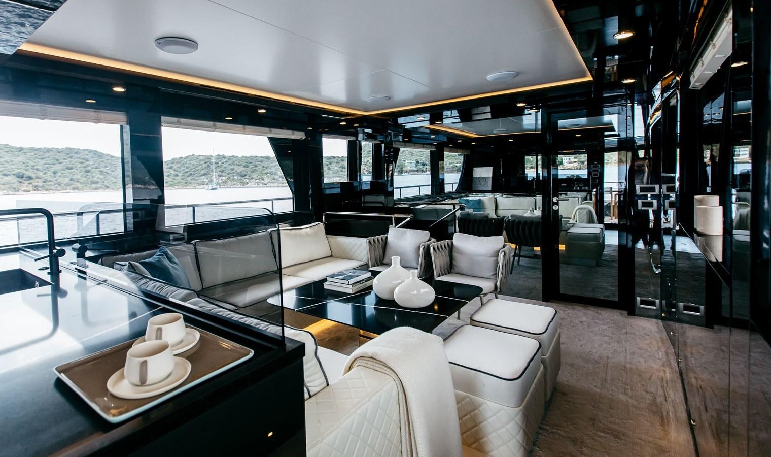 a room with a large window and a view of the ocean aboard BERING 70 LEVANNA Yacht for Sale