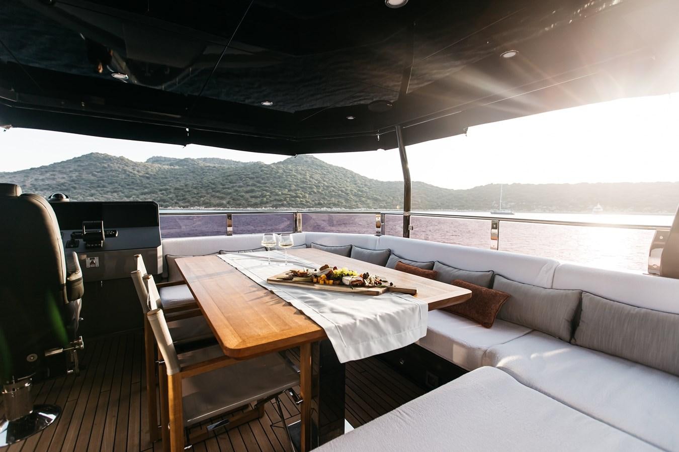 a table and chairs in a room aboard BERING 70 LEVANNA Yacht for Sale