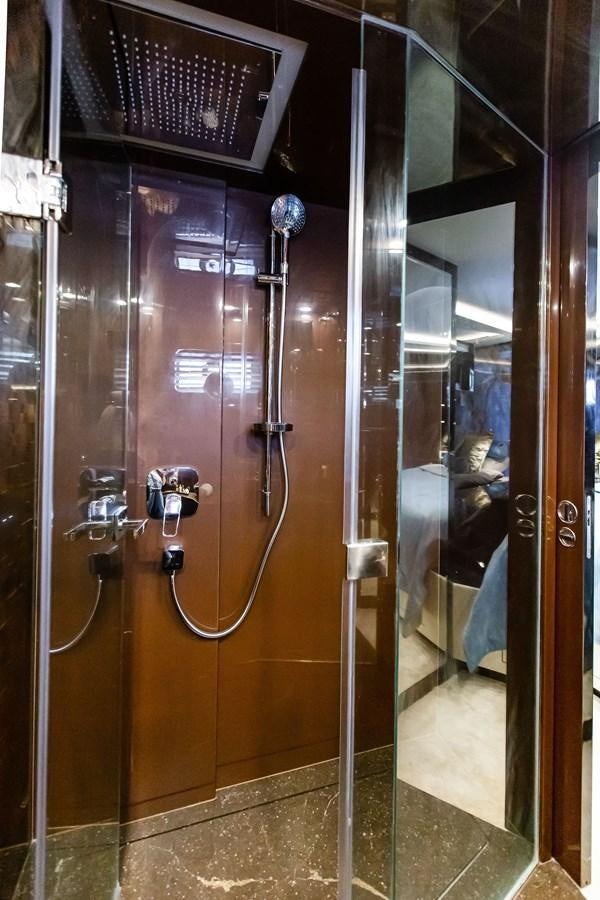 a glass wall with a screen aboard BERING 70 LEVANNA Yacht for Sale