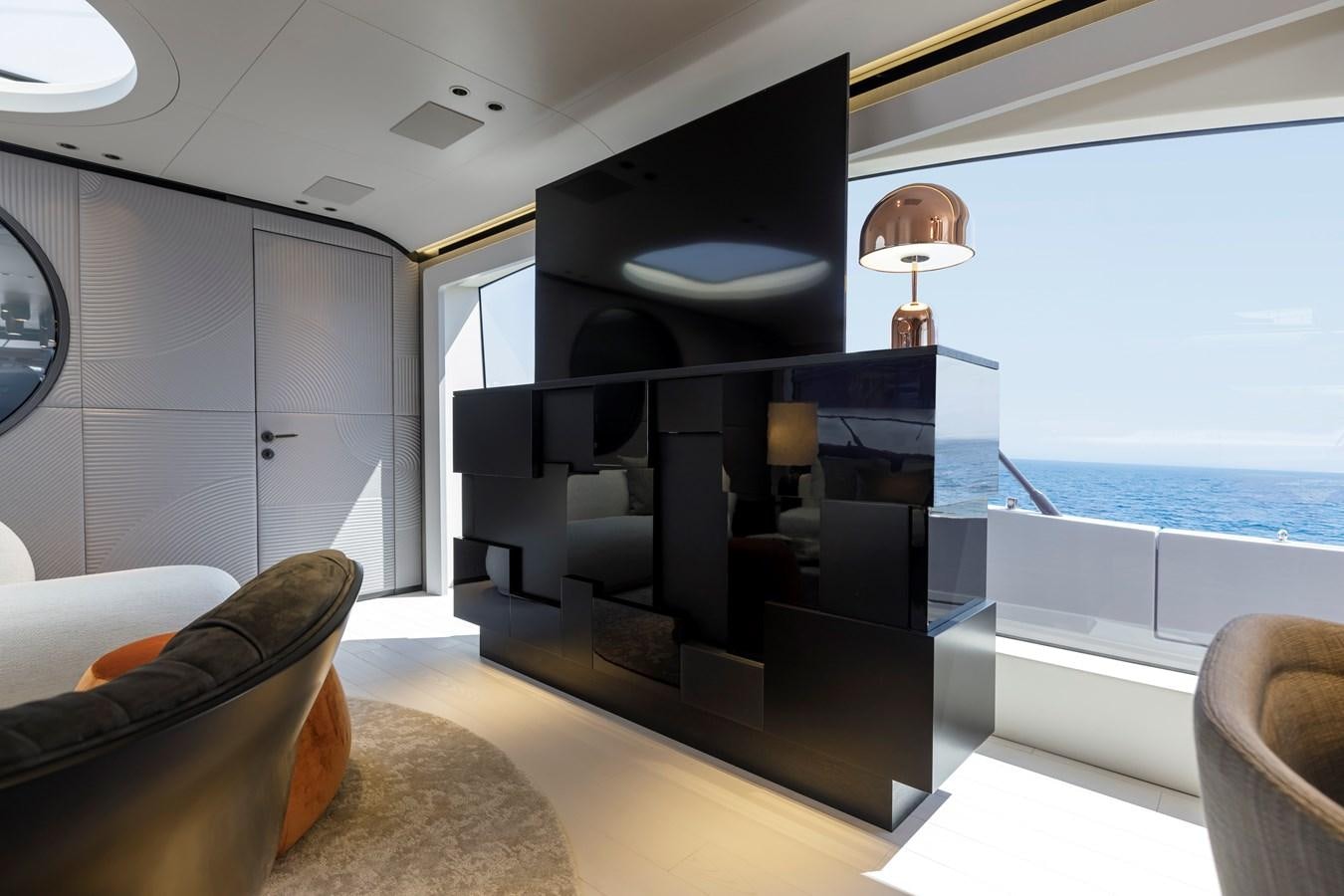 a room with a large window and a view of the ocean aboard MANGUSTA MAXIOPEN 104 REV #04 - EREIVA - CAREFULLY USED Yacht for Sale