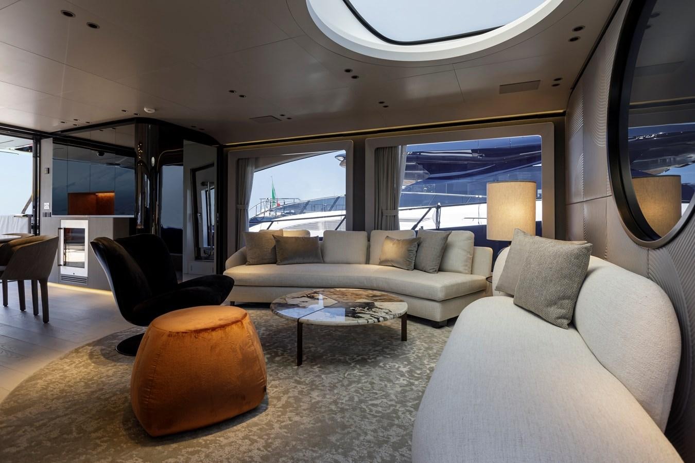 a living room with a large window aboard MANGUSTA MAXIOPEN 104 REV #04 - EREIVA - CAREFULLY USED Yacht for Sale