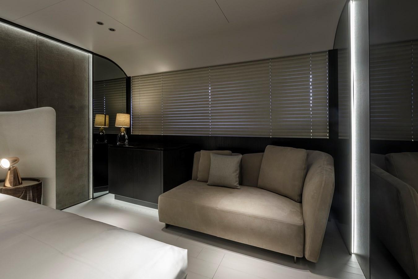 a room with a couch and a bed aboard MANGUSTA MAXIOPEN 104 REV #04 - EREIVA - CAREFULLY USED Yacht for Sale