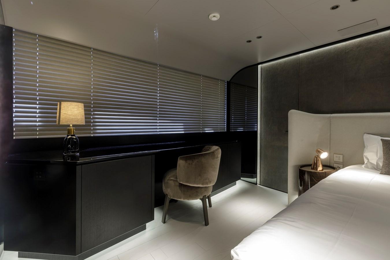 a room with a piano and a chair aboard MANGUSTA MAXIOPEN 104 REV #04 - EREIVA - CAREFULLY USED Yacht for Sale