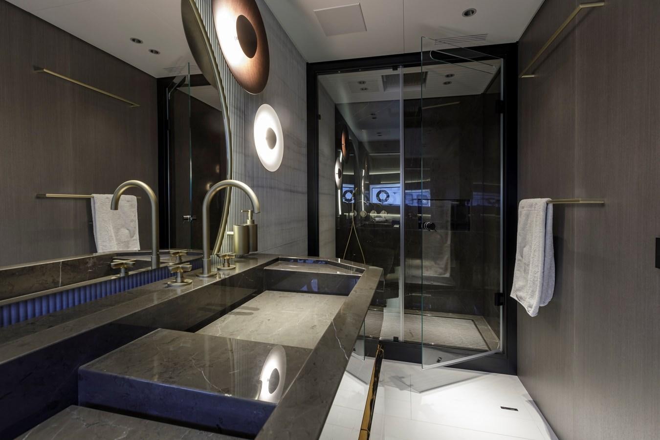 a bathroom with a large glass shower aboard MANGUSTA MAXIOPEN 104 REV #04 - EREIVA - CAREFULLY USED Yacht for Sale