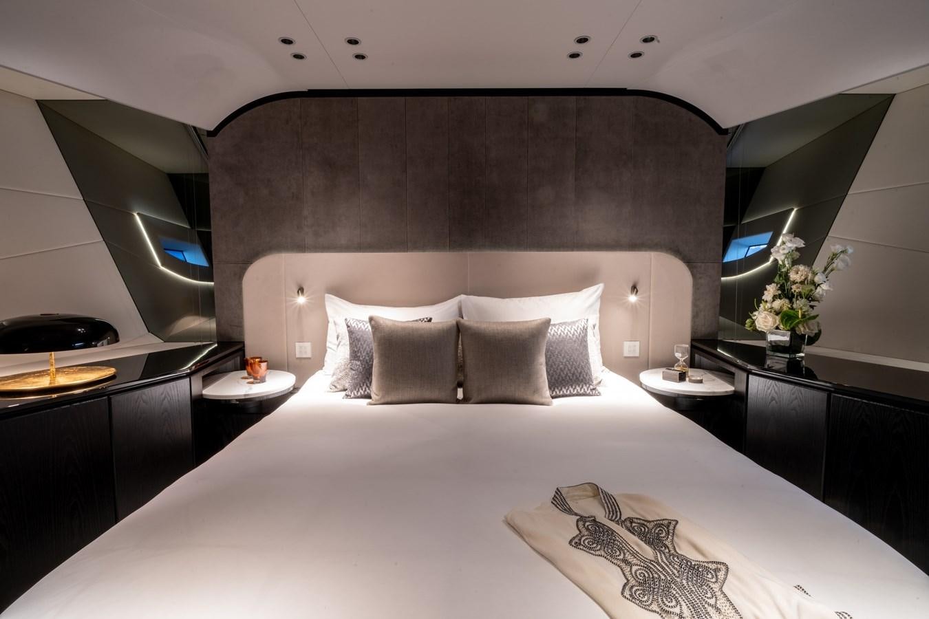 a bed with white sheets aboard MANGUSTA MAXIOPEN 104 REV #04 - EREIVA - CAREFULLY USED Yacht for Sale