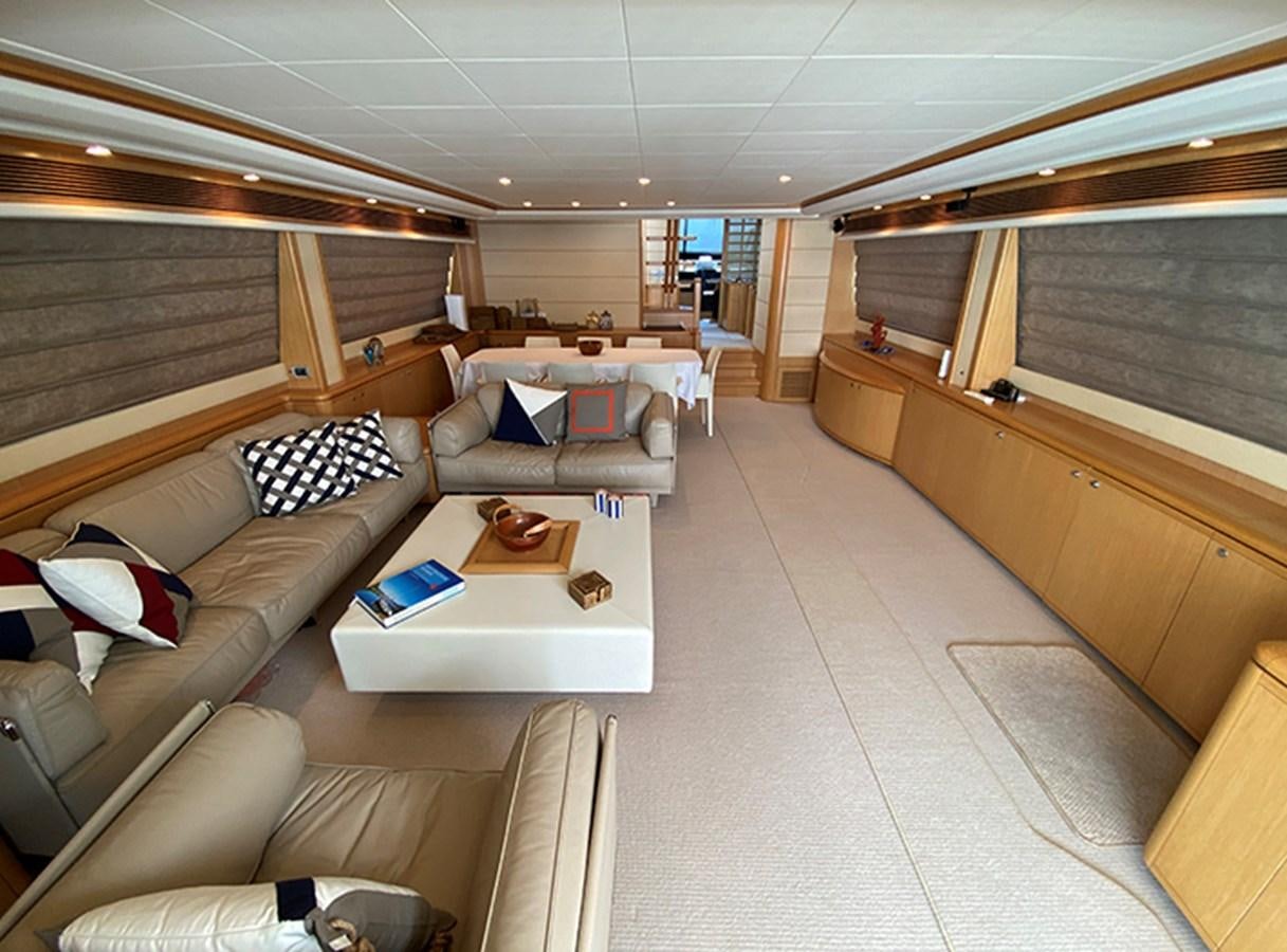 a room with a couch and a table aboard BMO Yacht for Sale