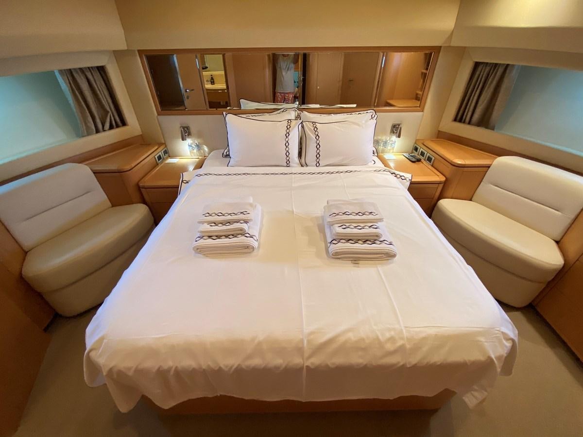 a bed with a white sheet and a white pillow aboard BMO Yacht for Sale