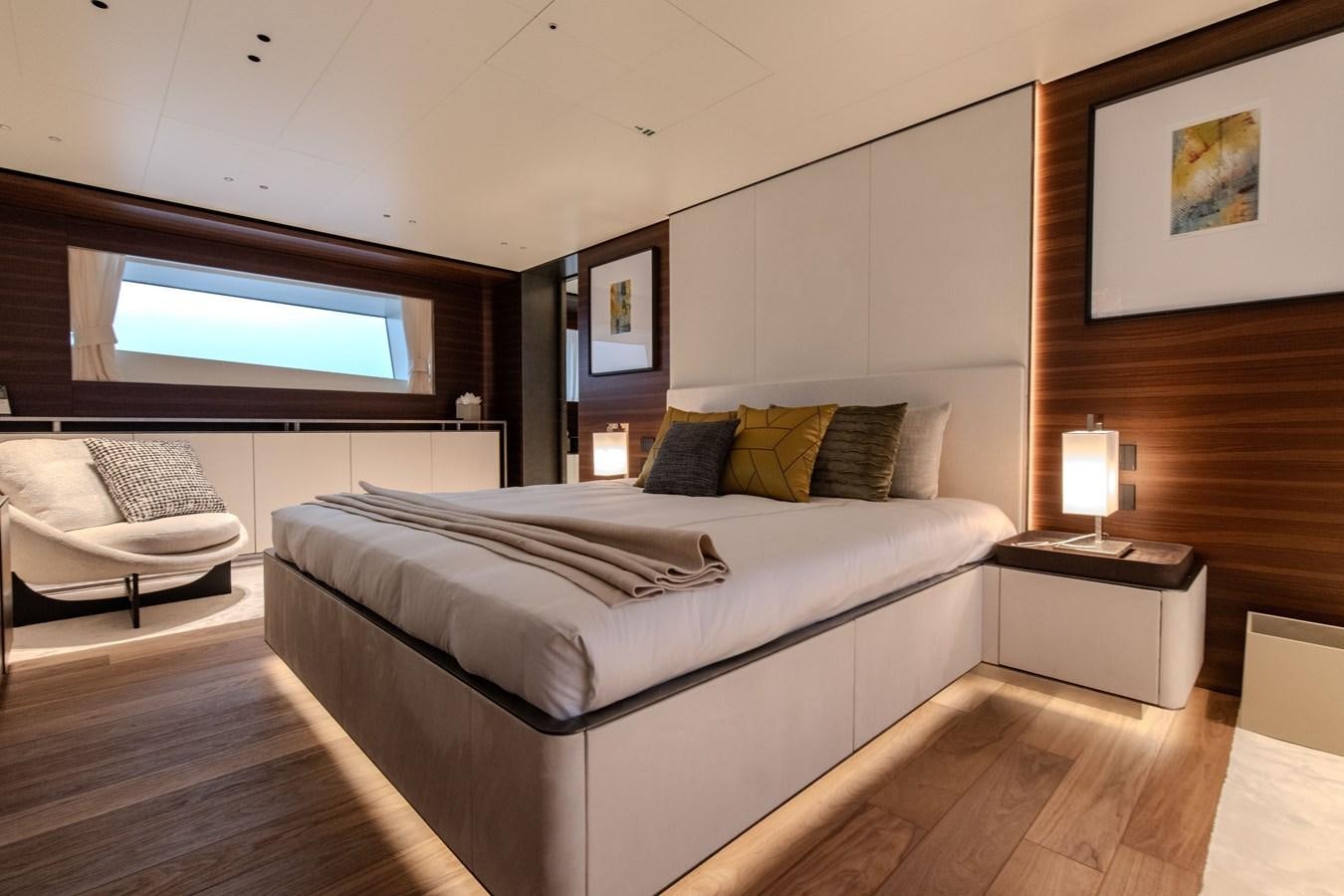 a bedroom with a bed and a couch aboard COLUMBUS ATLANTIQUE 37/01 Yacht for Sale