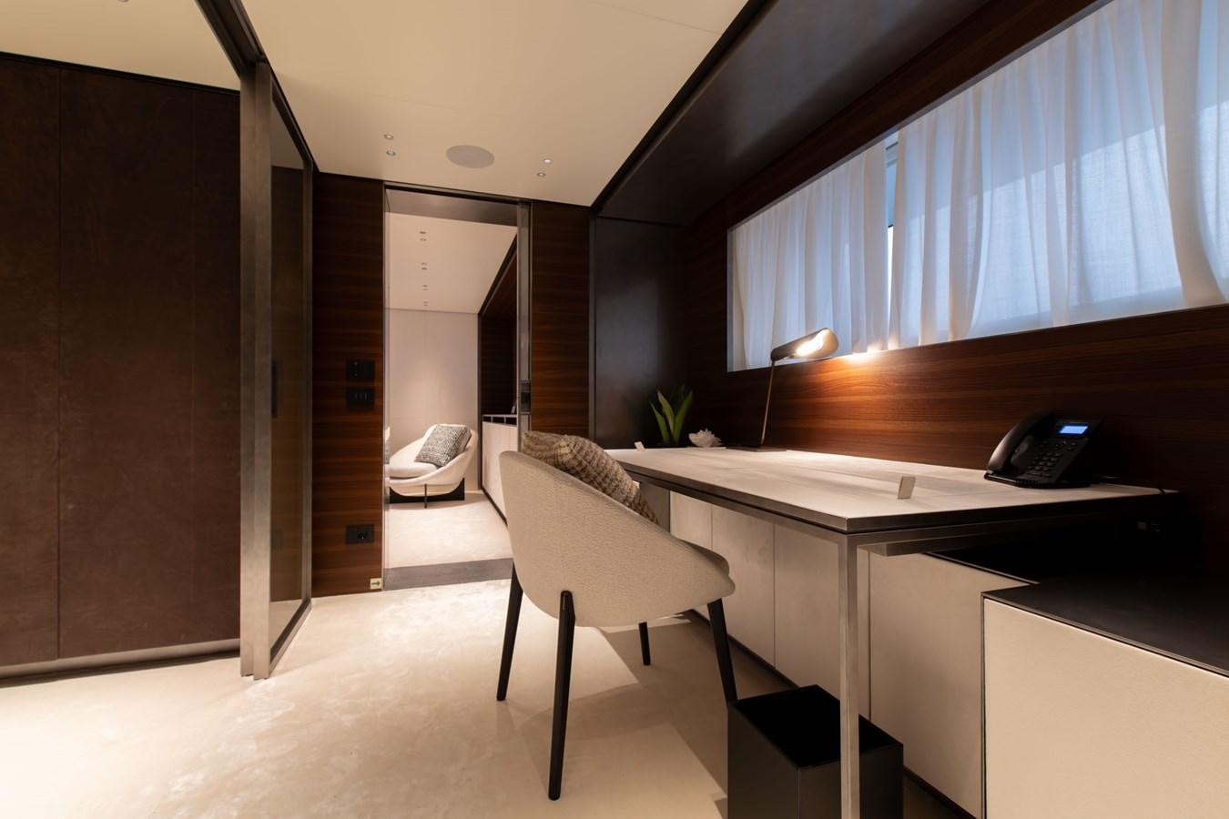 a room with a desk and a chair aboard COLUMBUS ATLANTIQUE 37/01 Yacht for Sale