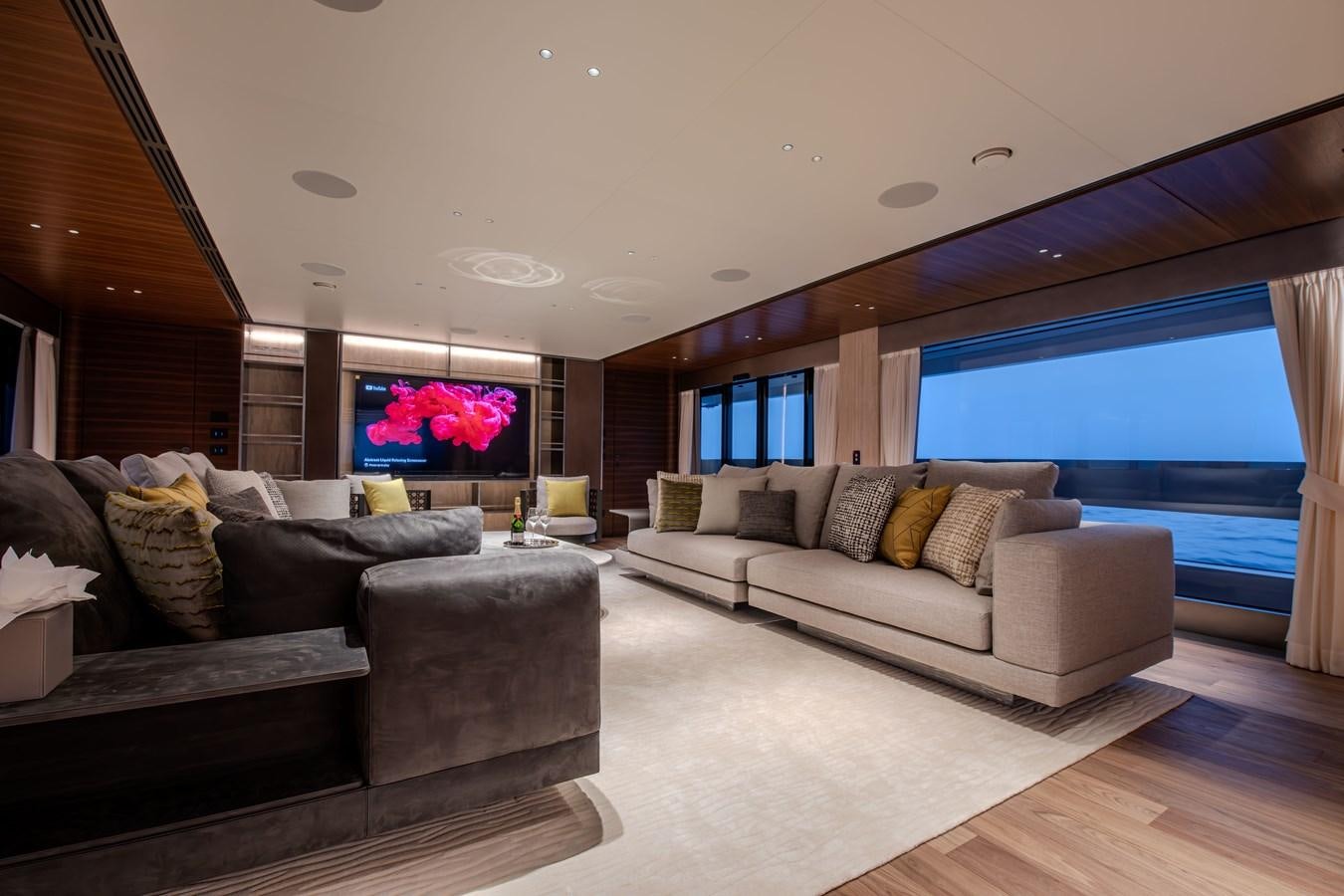 a living room with a large window aboard COLUMBUS ATLANTIQUE 37/01 Yacht for Sale