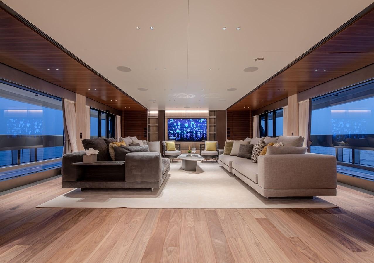 a living room with a large window aboard COLUMBUS ATLANTIQUE 37/01 Yacht for Sale