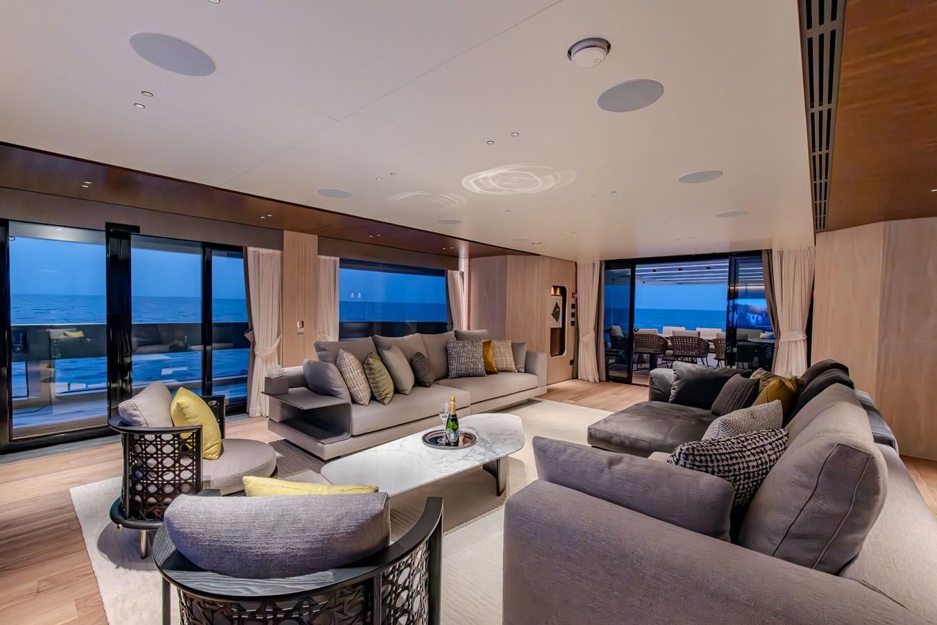 a living room with a large window aboard COLUMBUS ATLANTIQUE 37/01 Yacht for Sale