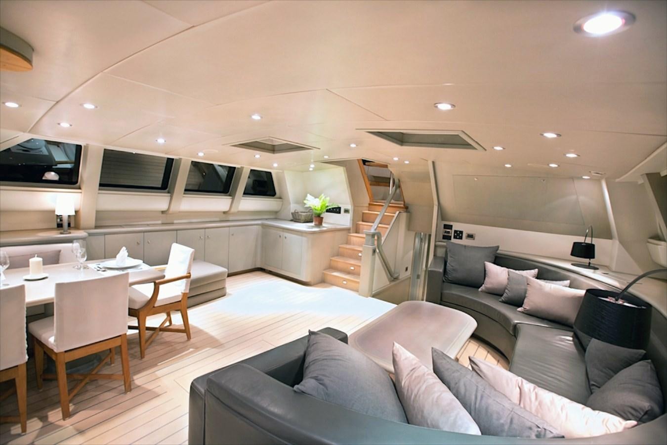 a living room with a large sofa aboard IEMANJA Yacht for Sale