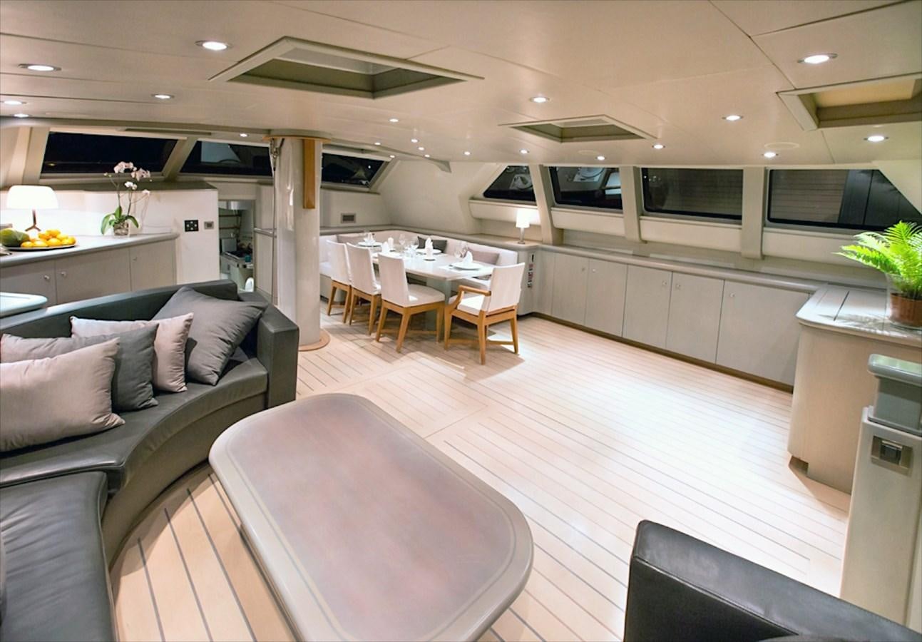 a living room with a couch and a table aboard IEMANJA Yacht for Sale