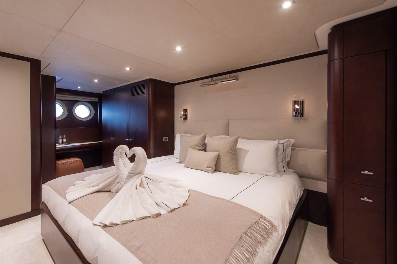 a hotel room with a bed aboard KORU Yacht for Sale