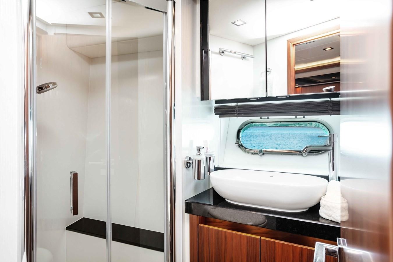 a bathroom with a sink and a shower aboard SARAH Yacht for Sale