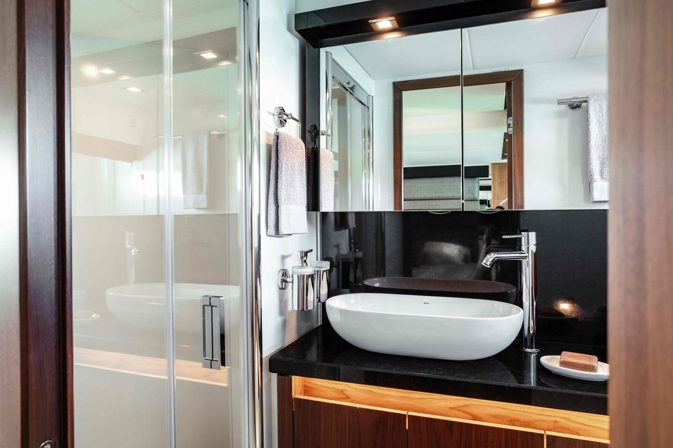 a bathroom with a sink and a shower aboard SARAH Yacht for Sale