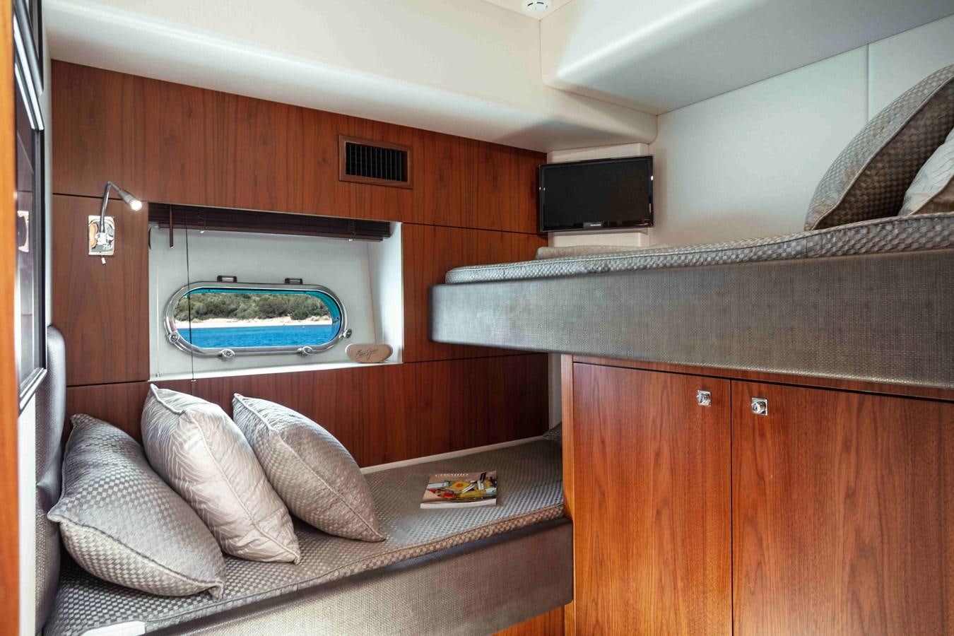 a room with a couch and a television aboard SARAH Yacht for Sale