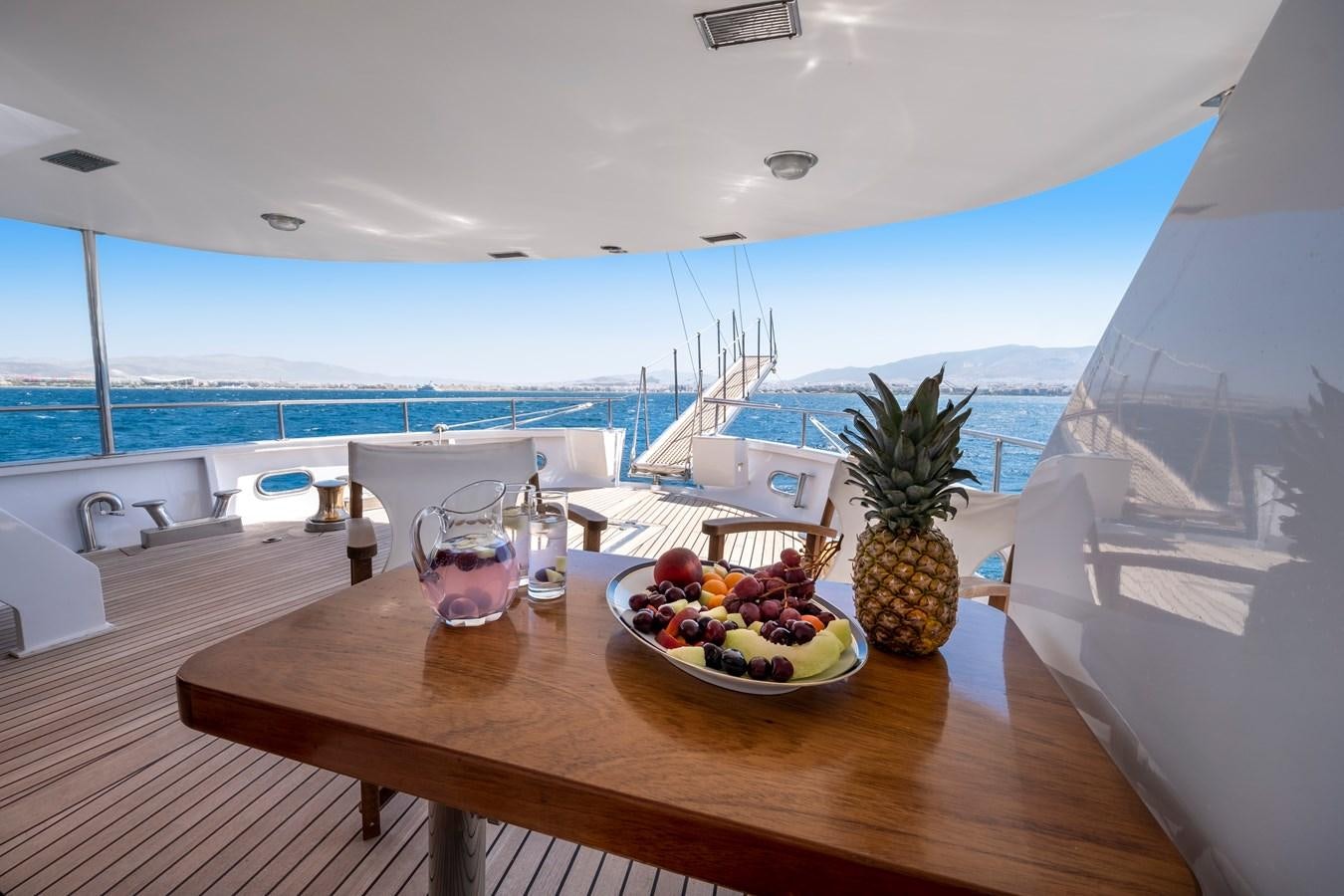a table with fruit on it aboard ATHINA Yacht for Sale