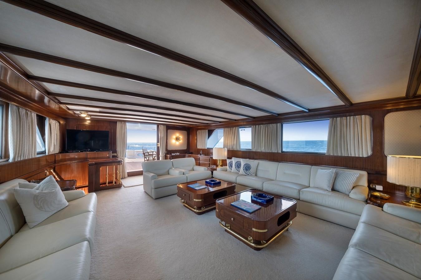 a living room with a large window aboard ATHINA Yacht for Sale