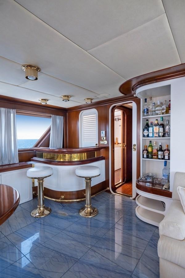 a room with a table and chairs aboard ATHINA Yacht for Sale
