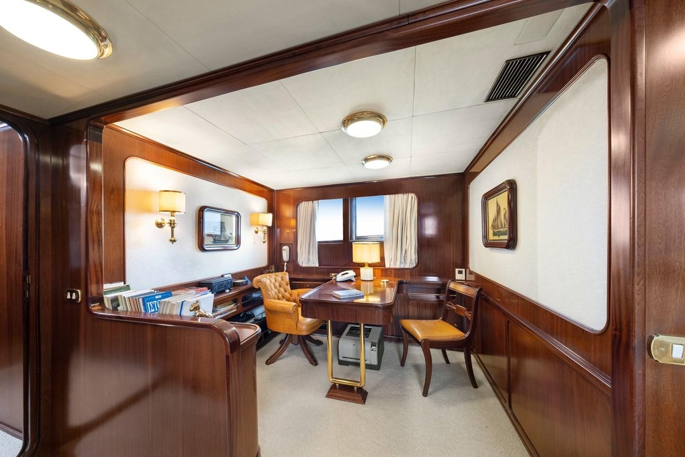 a room with a table and chairs aboard ATHINA Yacht for Sale