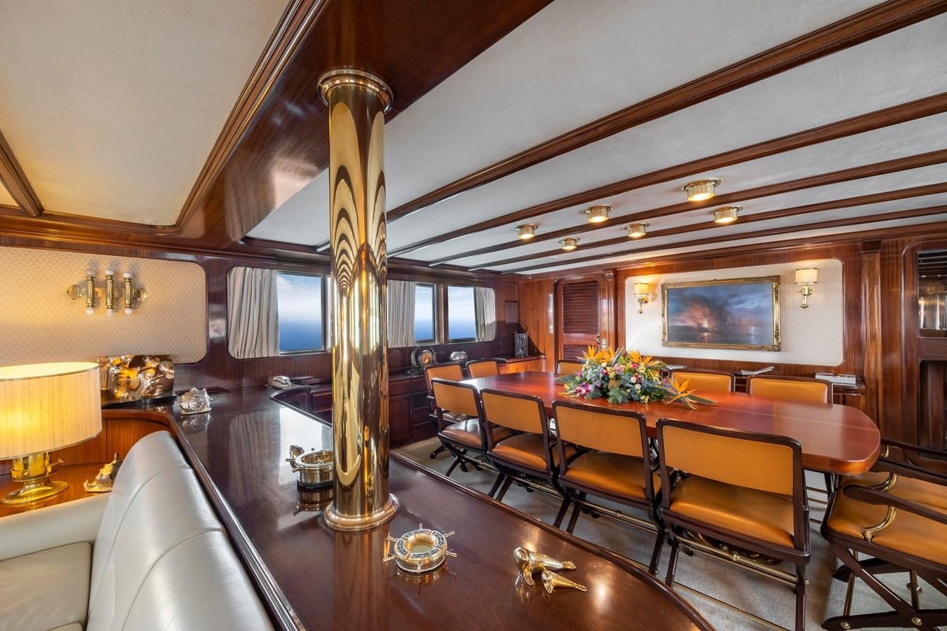 a large dining room with a chandelier aboard ATHINA Yacht for Sale