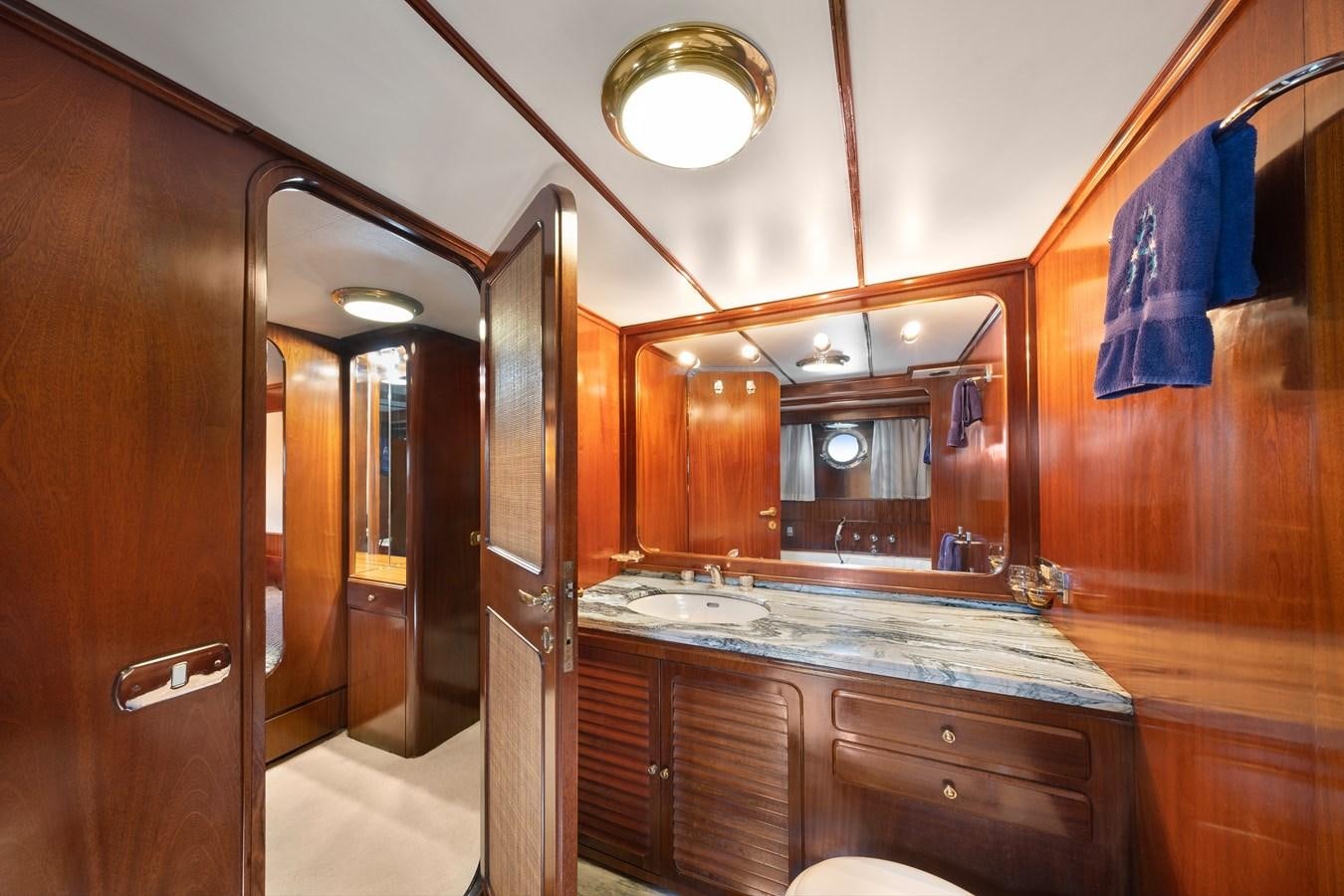 a bathroom with a countertop sink and mirrors aboard ATHINA Yacht for Sale