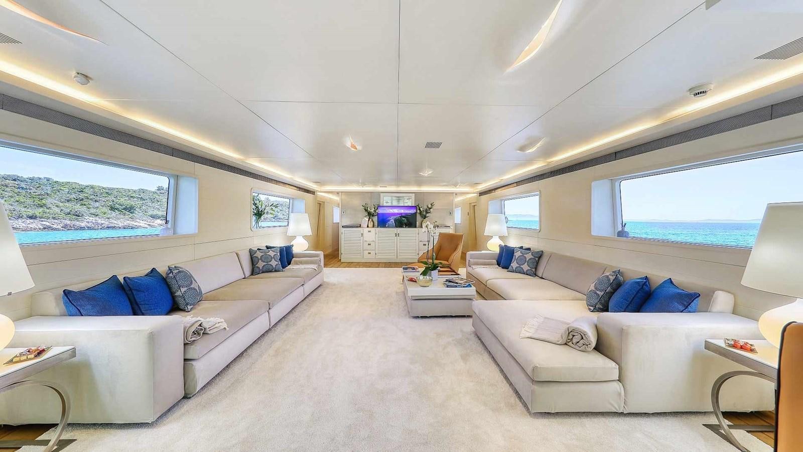 a living room with a couch and a television aboard ANAVI Yacht for Sale