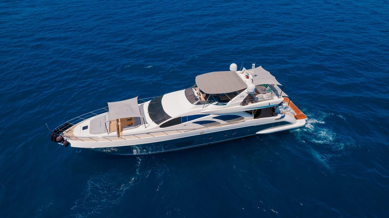 a white boat in the water aboard LEONARDO Yacht for Sale
