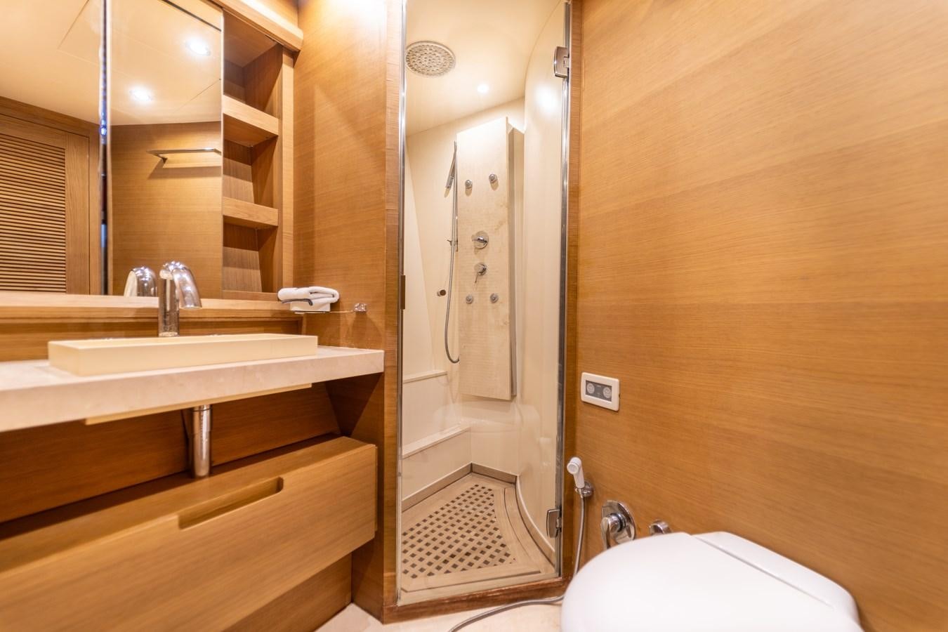 a bathroom with a sink and a mirror aboard LEONARDO Yacht for Sale