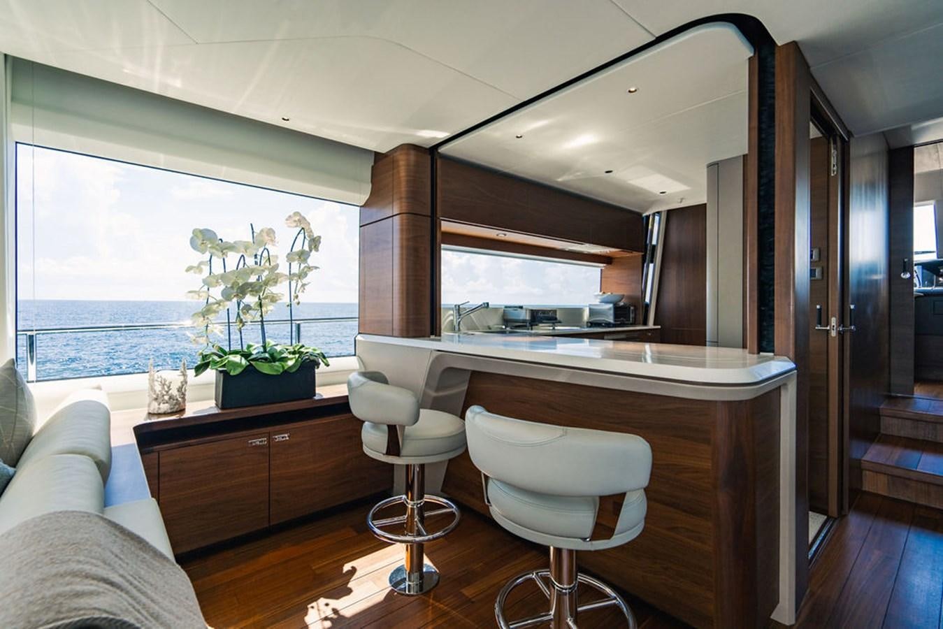 a kitchen with a large window aboard TBANK Yacht for Sale