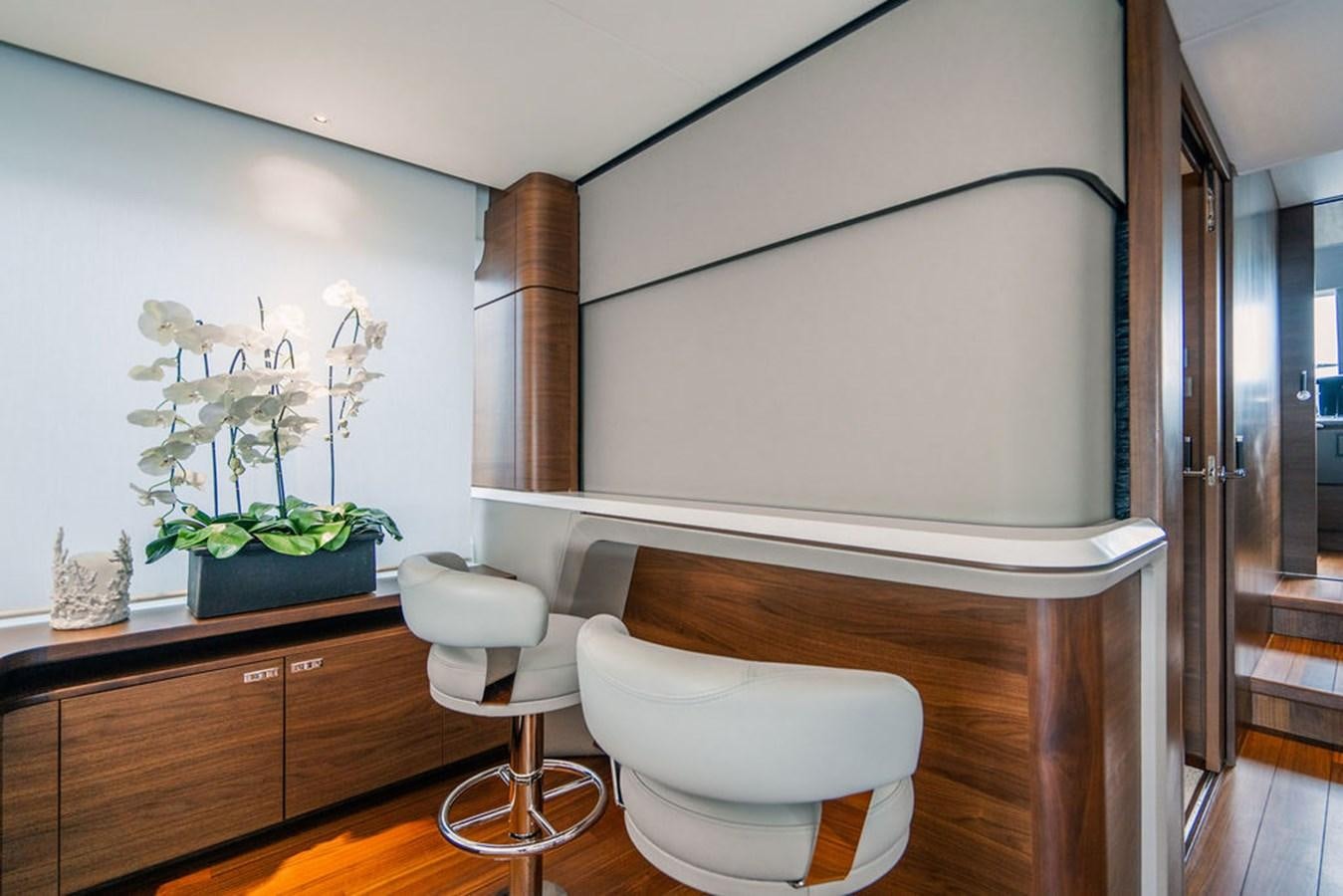a white chair in a room aboard TBANK Yacht for Sale