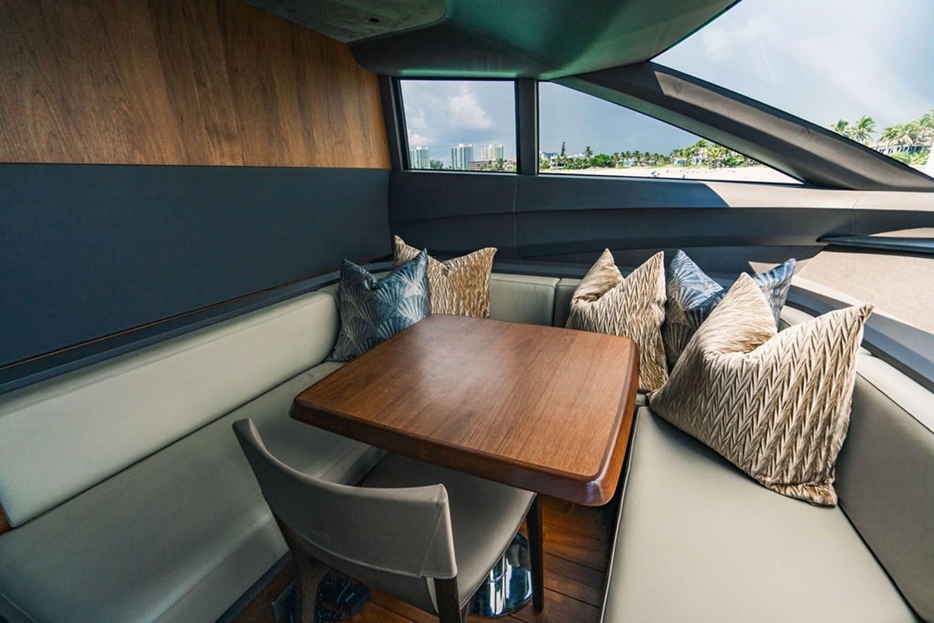 a table with pillows on it aboard TBANK Yacht for Sale