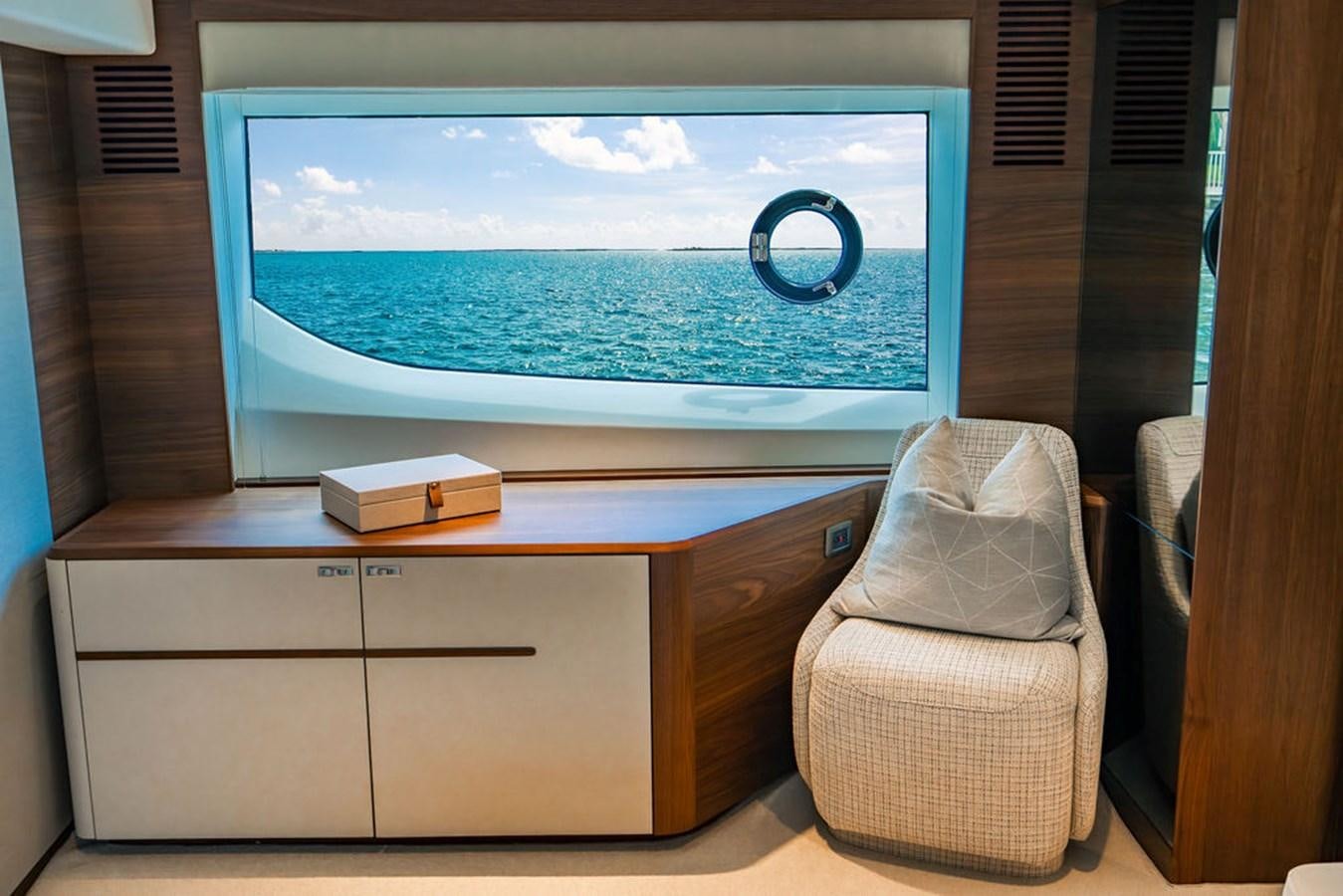 a room with a tv and a chair aboard TBANK Yacht for Sale