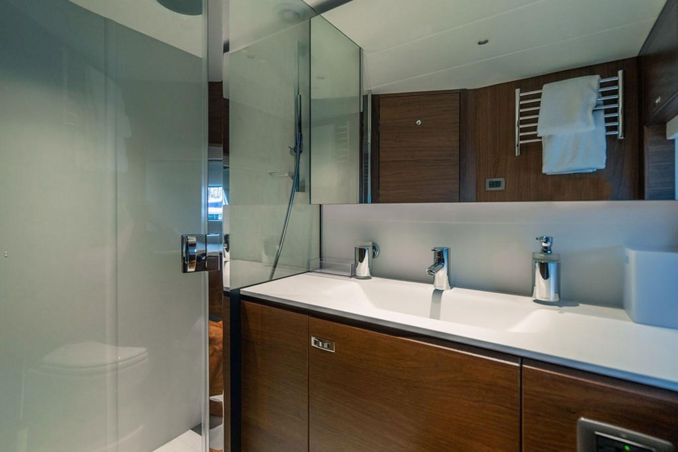 a bathroom with a large mirror aboard TBANK Yacht for Sale
