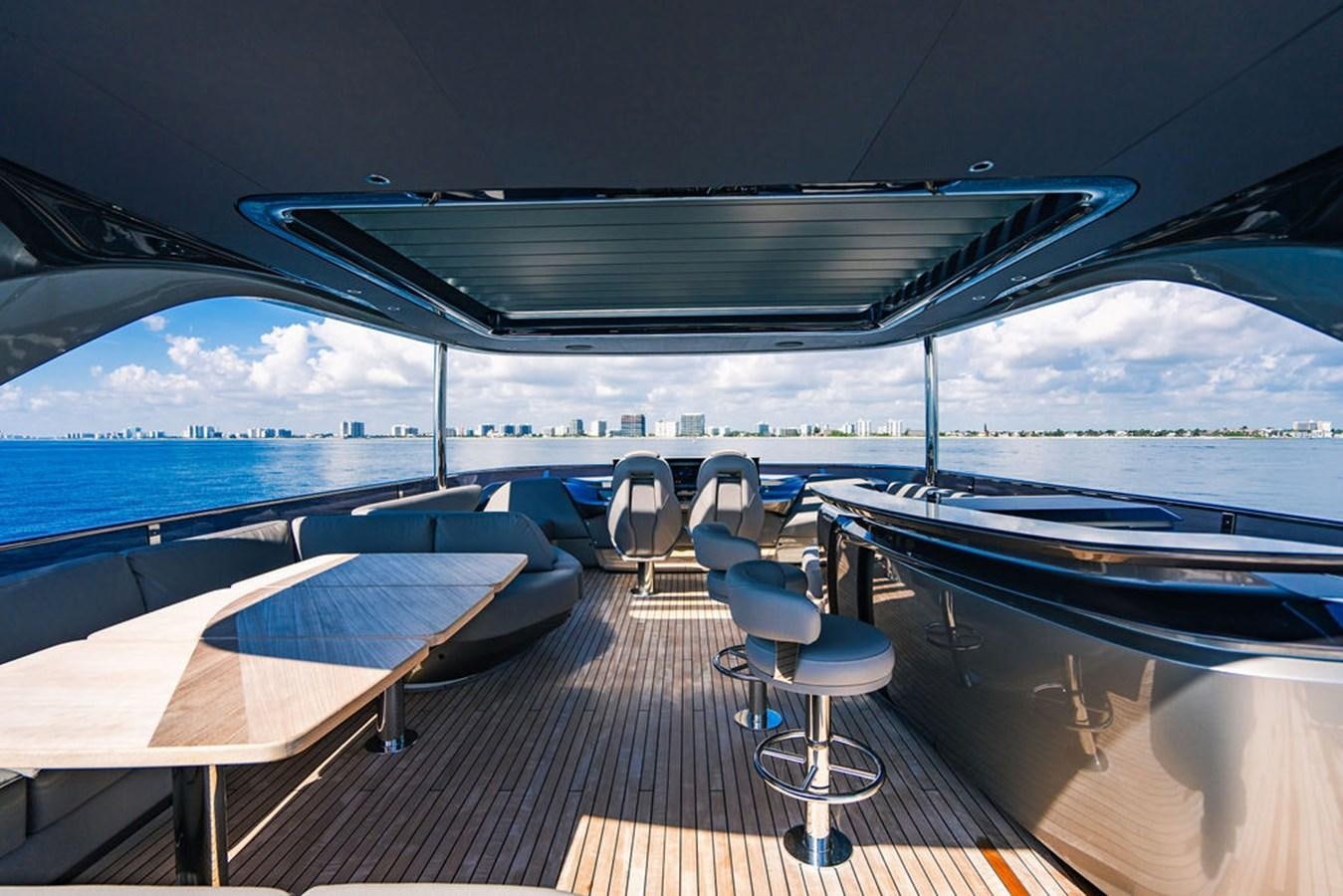 a deck with a view of the ocean and a deck aboard TBANK Yacht for Sale