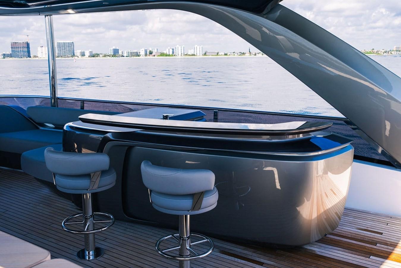 a pool table with chairs aboard TBANK Yacht for Sale