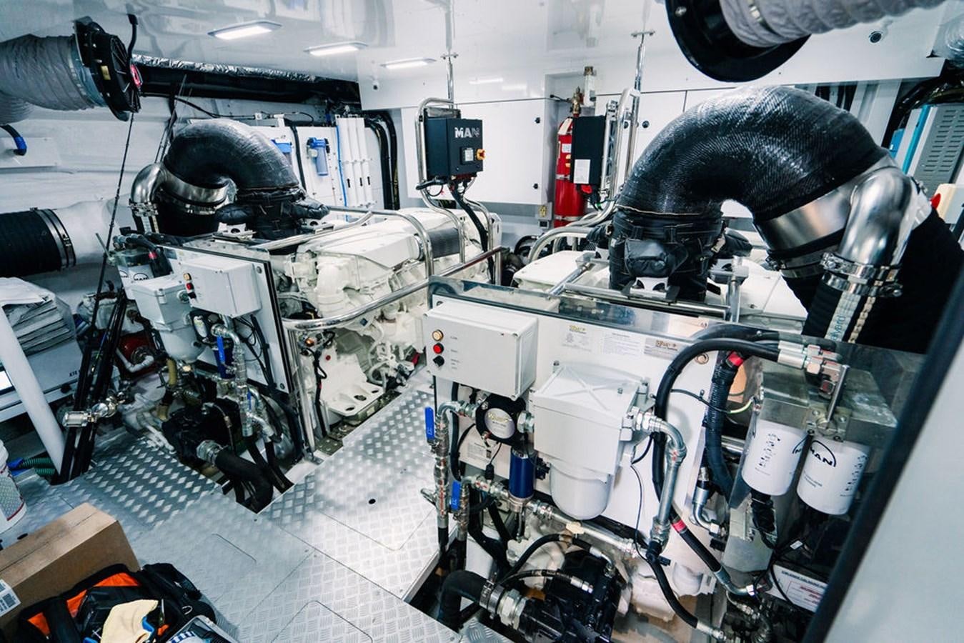 a person working on a machine aboard TBANK Yacht for Sale