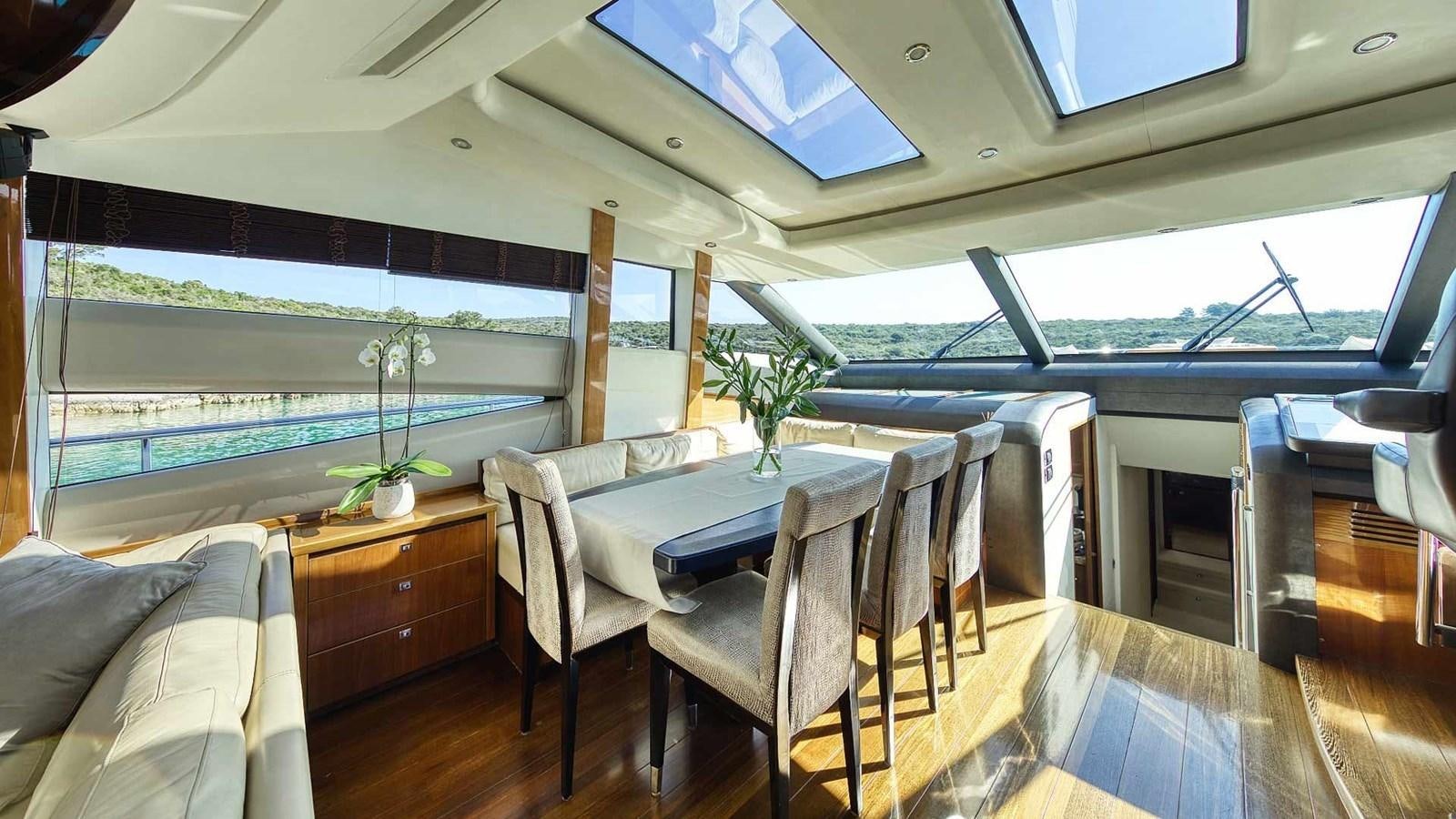 a room with a table and chairs aboard AGAVE Yacht for Sale