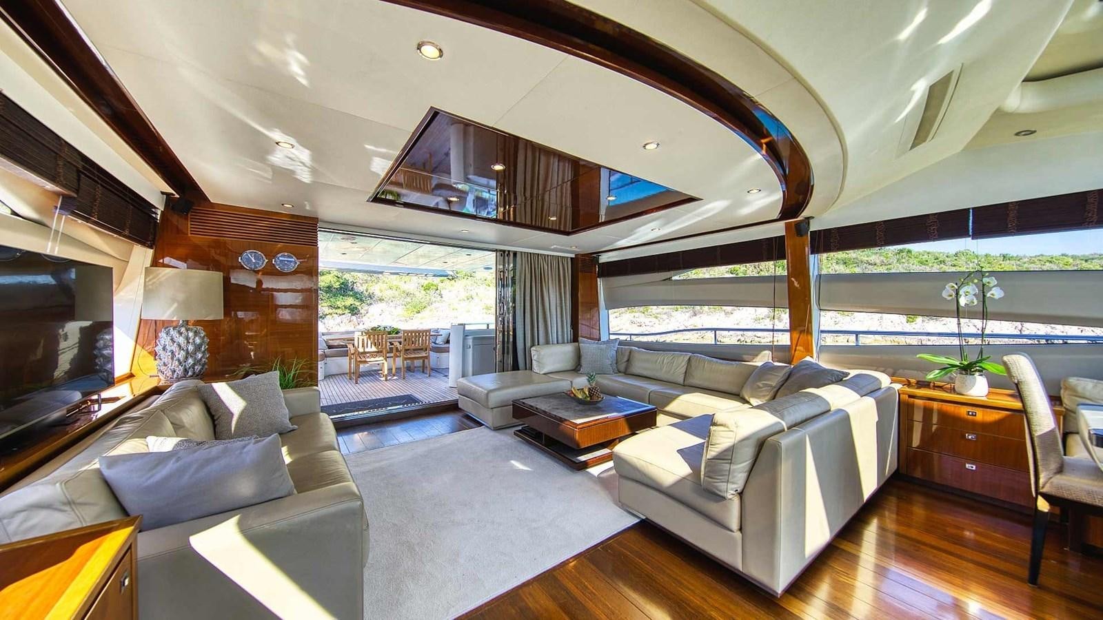 a living room with a large window aboard AGAVE Yacht for Sale