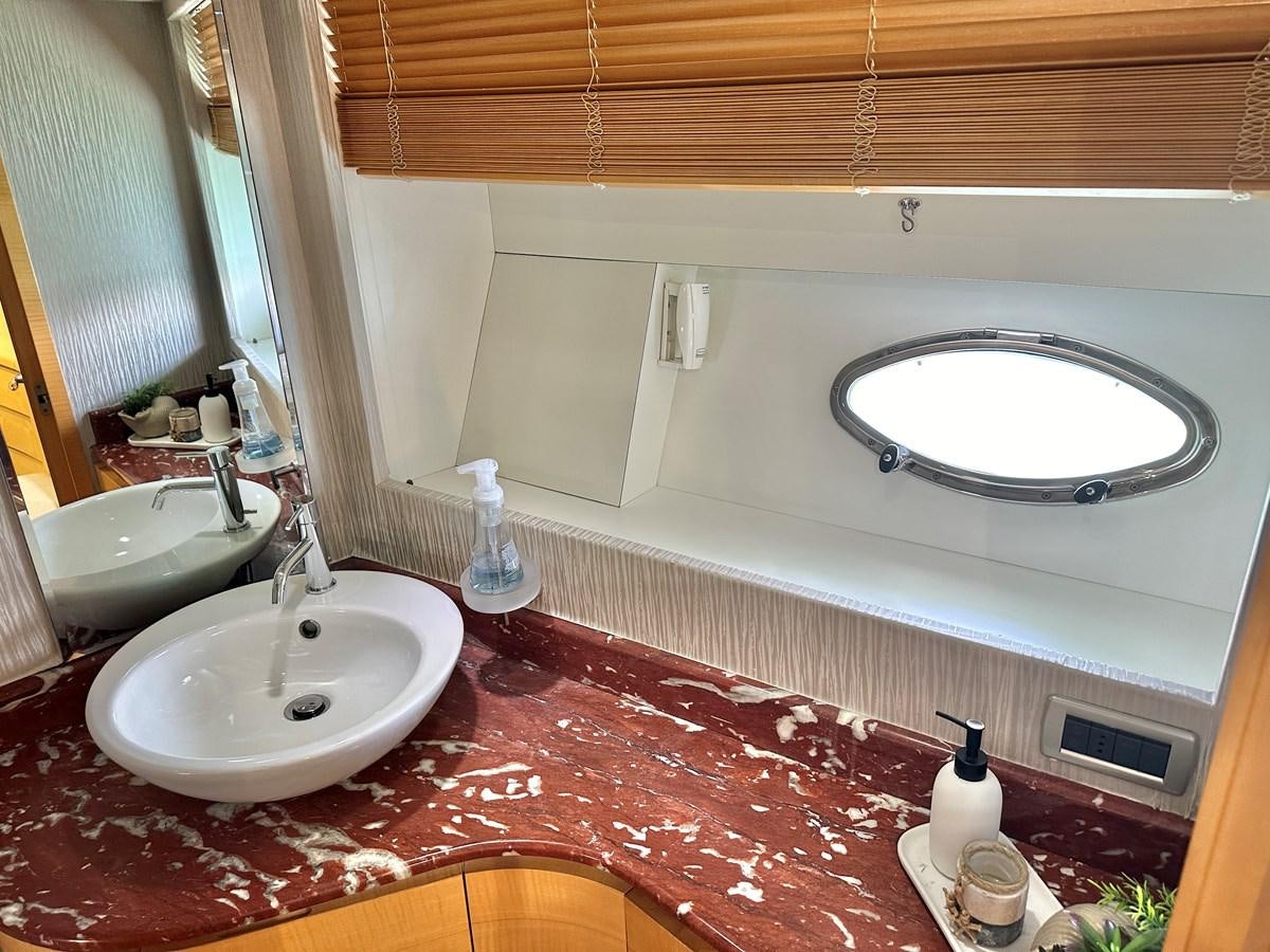 a bathroom with a large mirror aboard NOTORIUS Yacht for Sale