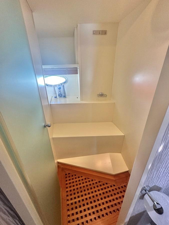 a bathroom with a mirror aboard NOTORIUS Yacht for Sale