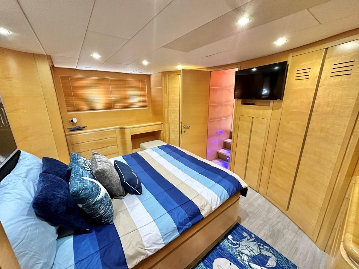 a bed in a room aboard NOTORIUS Yacht for Sale