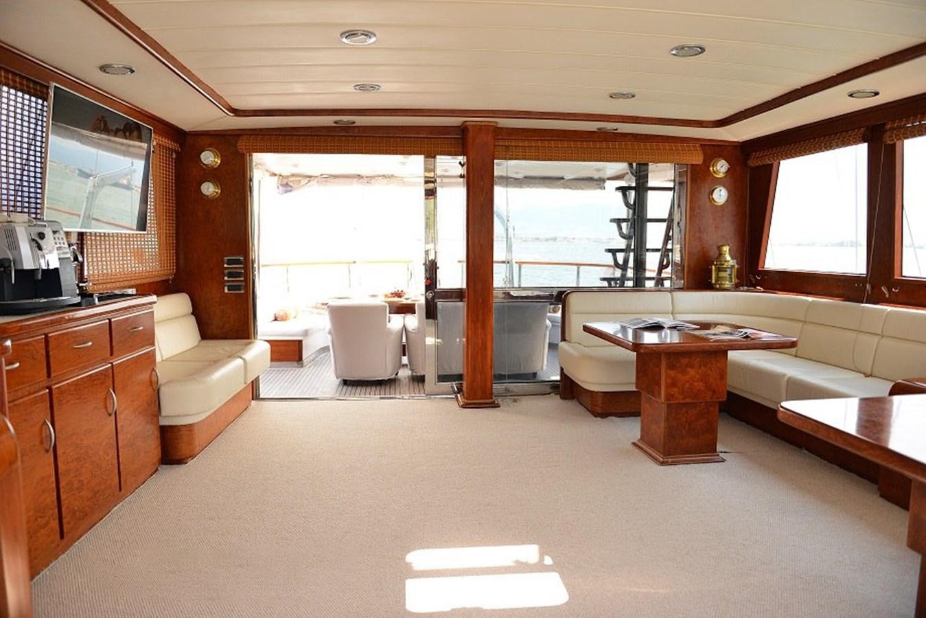 a large living room with a large window aboard EUPH Yacht for Sale