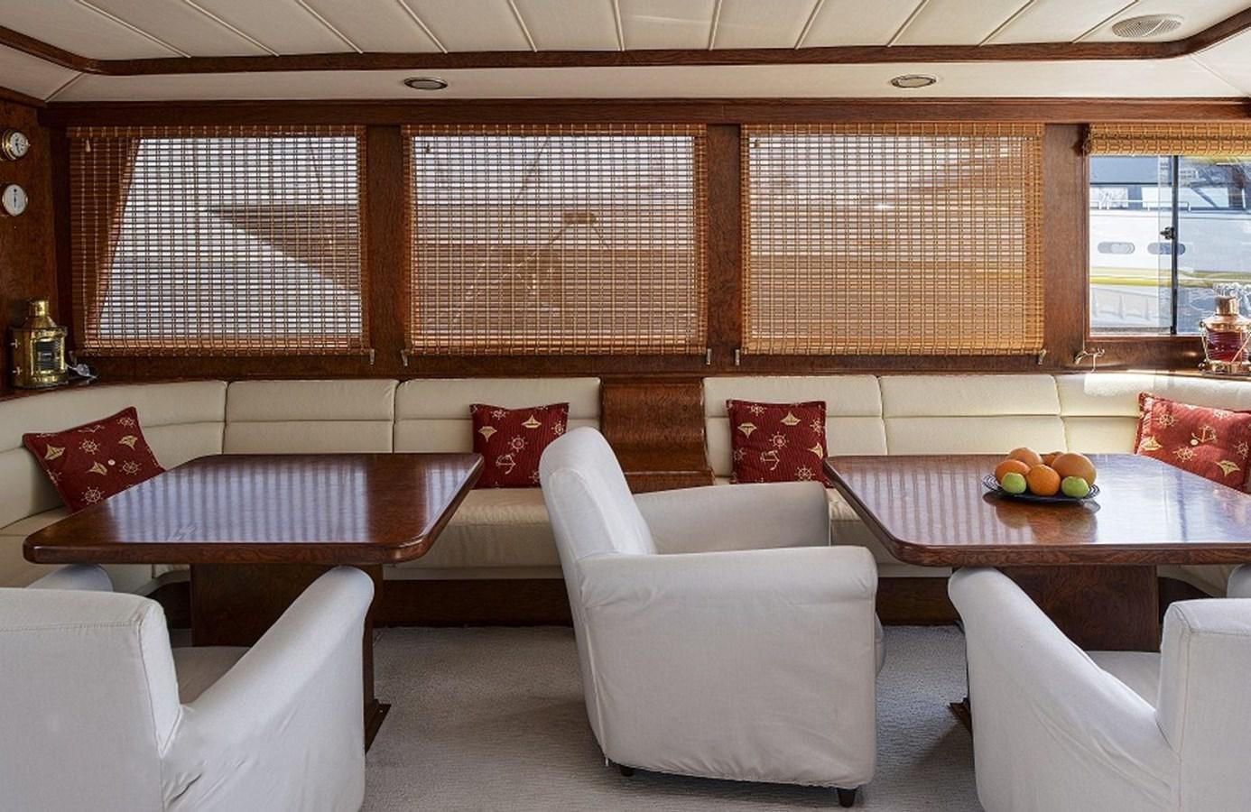 a room with couches and a table aboard EUPH Yacht for Sale