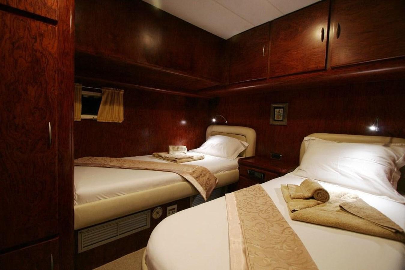 a room with two beds aboard EUPH Yacht for Sale
