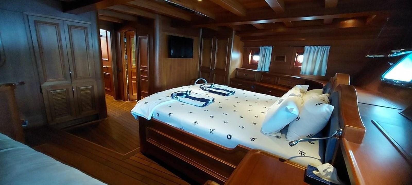 a bed in a room aboard SYY Yacht for Sale