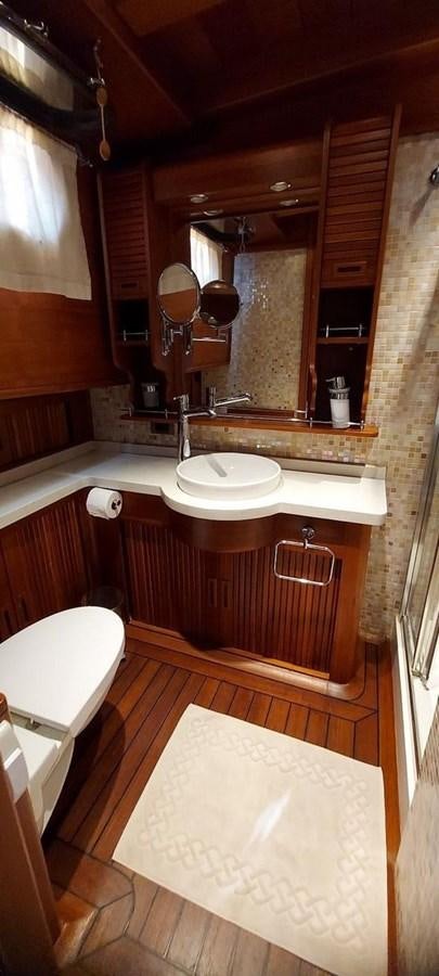 a bathroom with a sink and a mirror aboard SYY Yacht for Sale