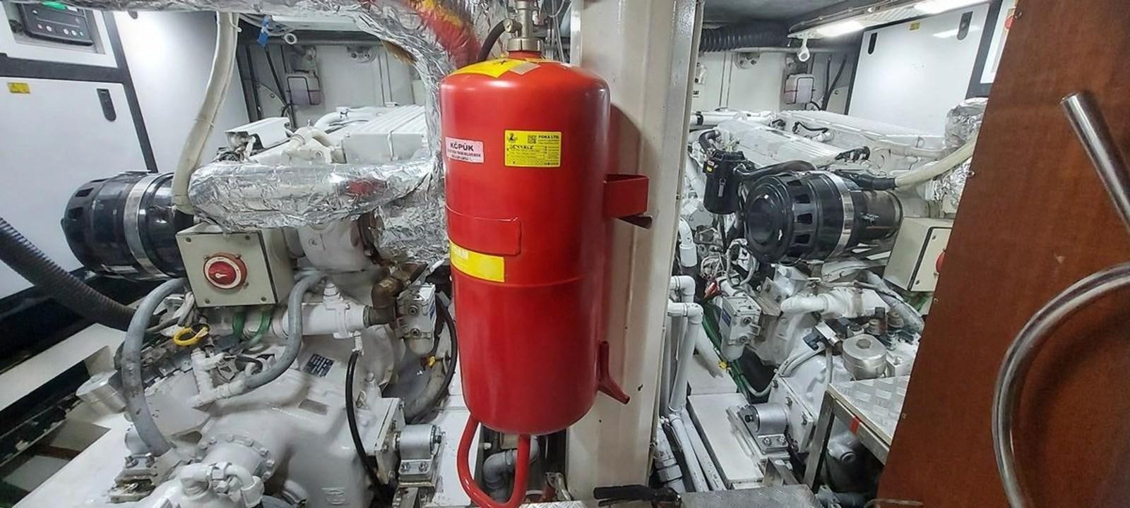 a machine with a red and yellow object in it aboard SYY Yacht for Sale